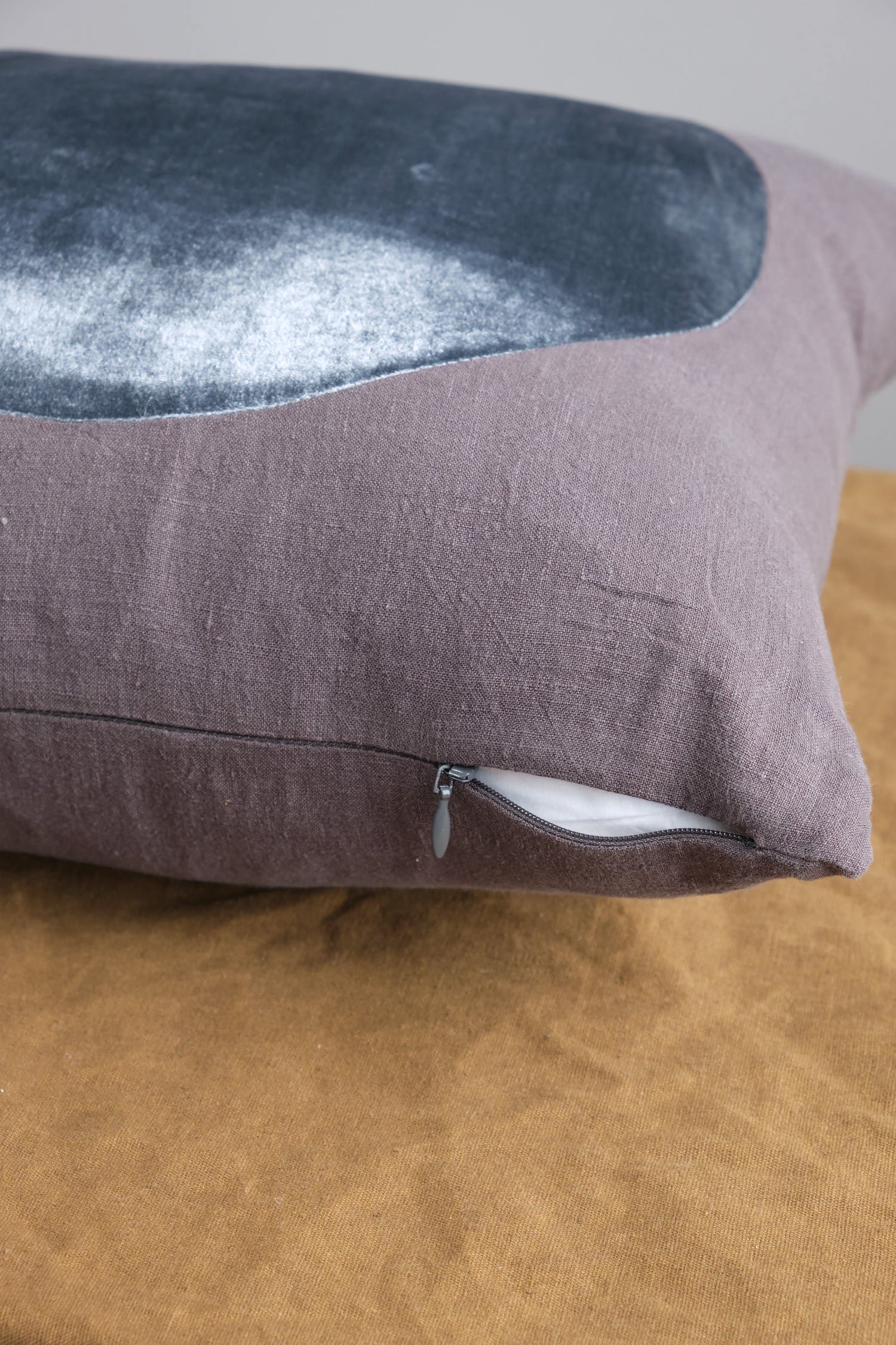 Hidden zip on Velvet Circle Pillow in Charcoal