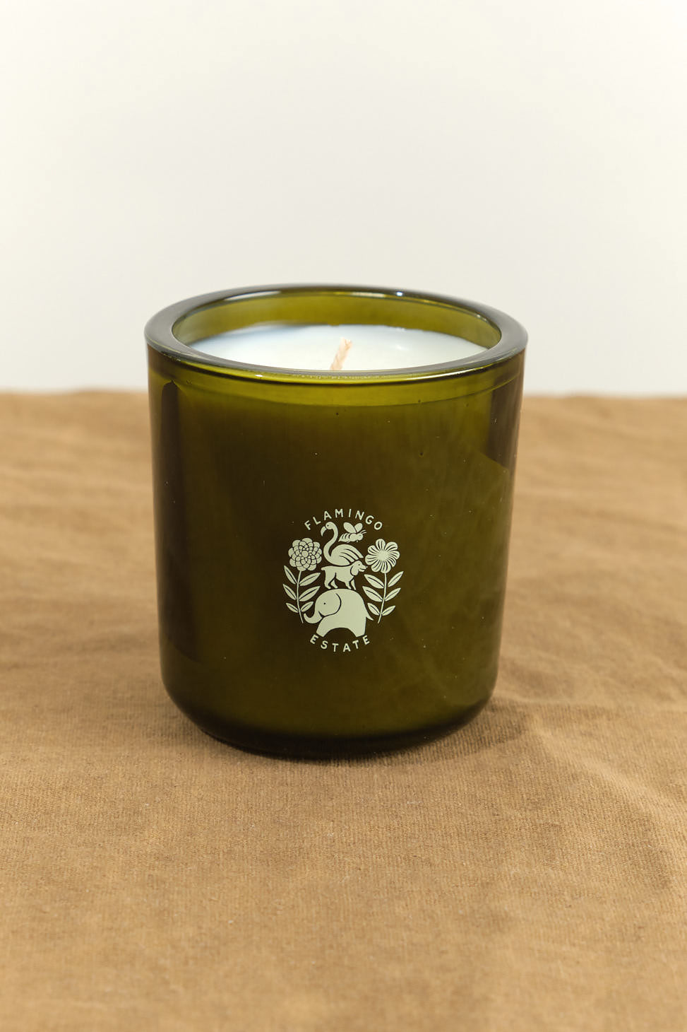 Climbing Tuscan Rosemary Candle on table