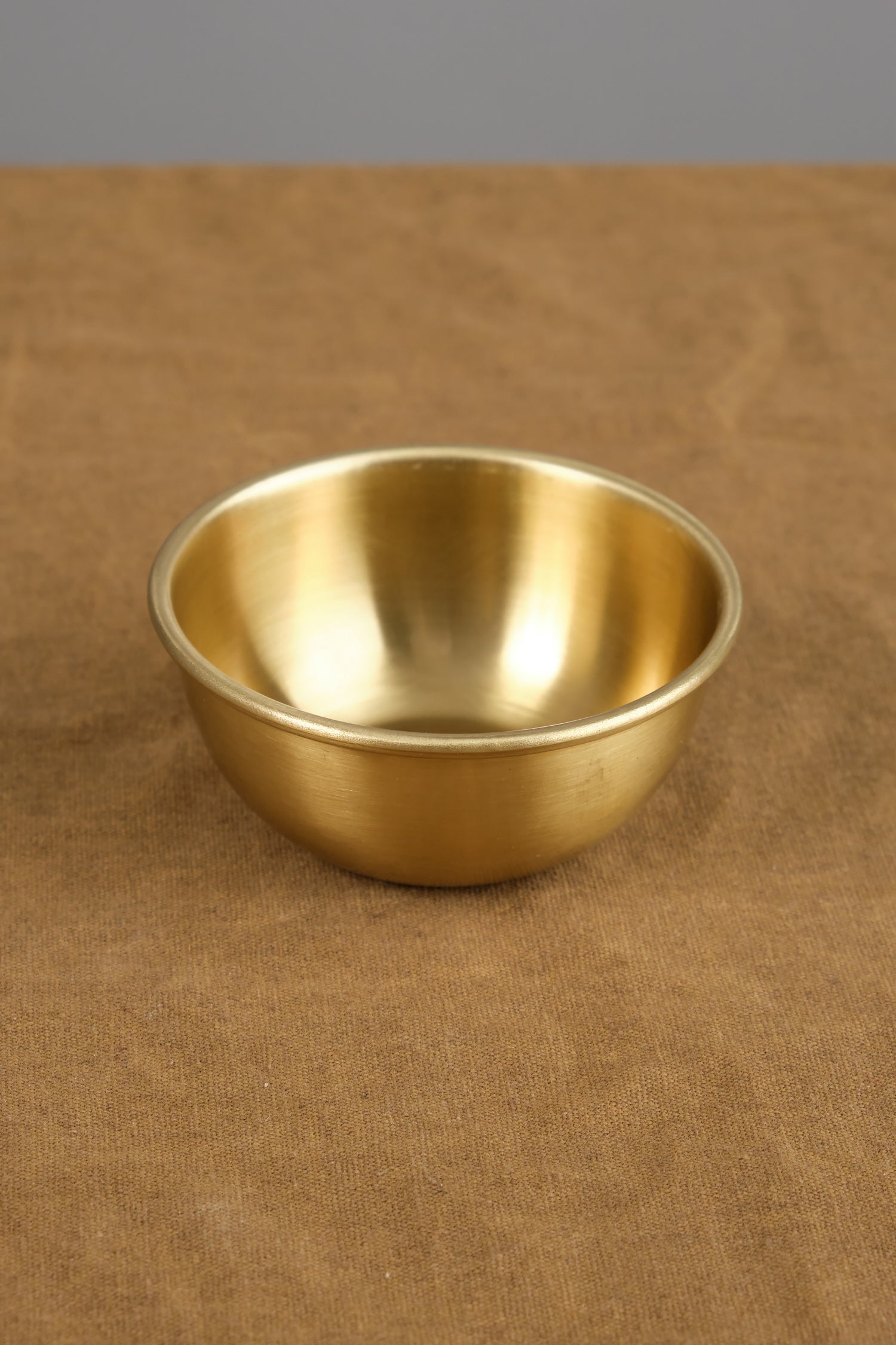 Small Brass Bowl on table