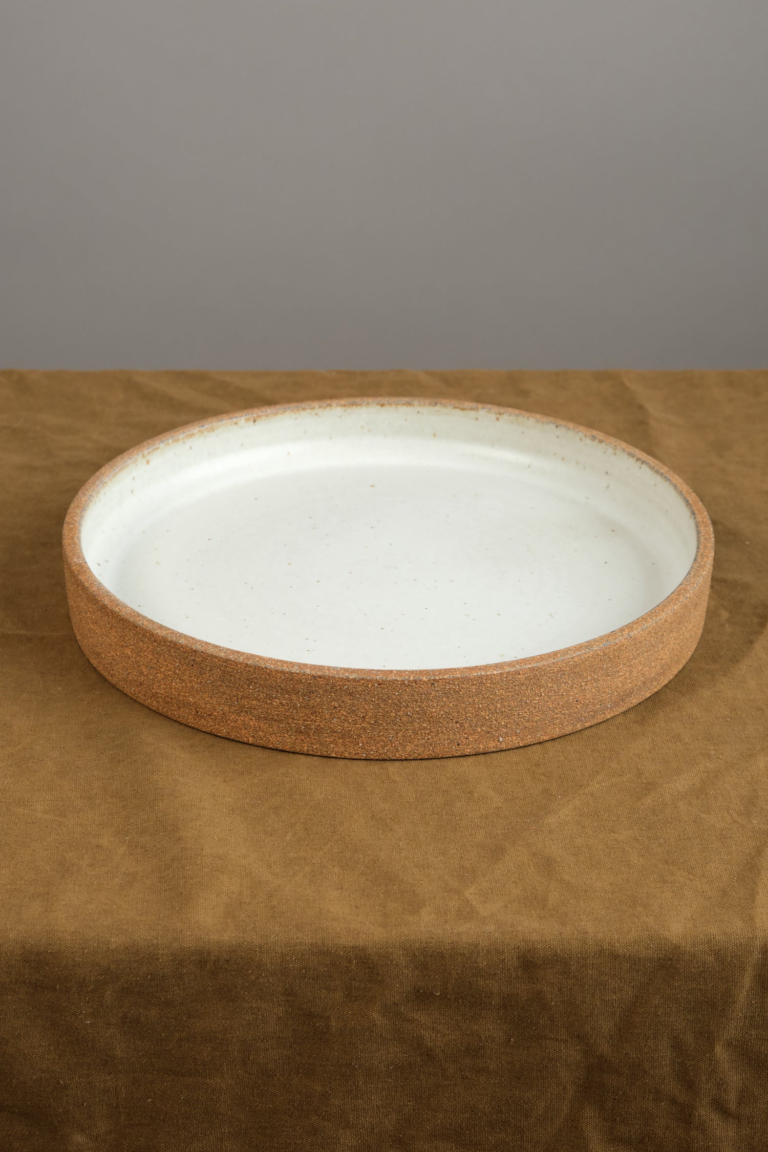 Cazuela Platter in Sandstone on table