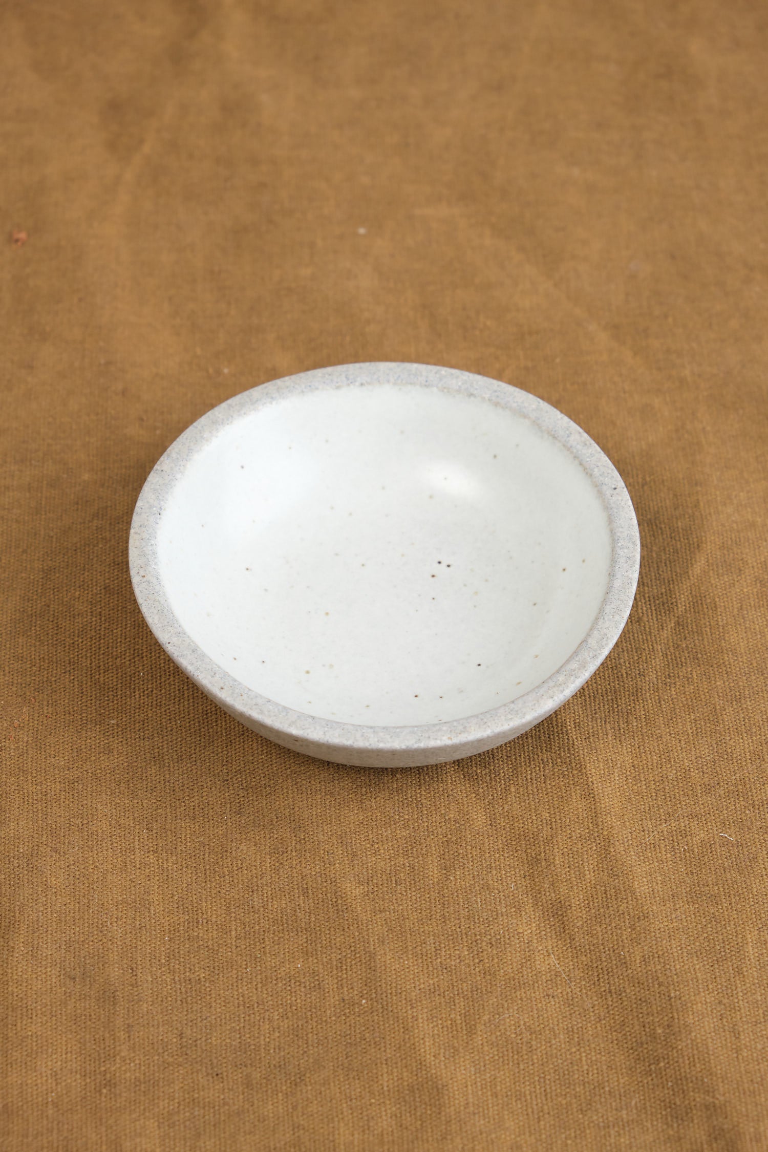 Mini Stillness Bowl in Greystone/Snow White on table