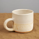 Close up of Stoneware Coffee Mug in White Stoneware