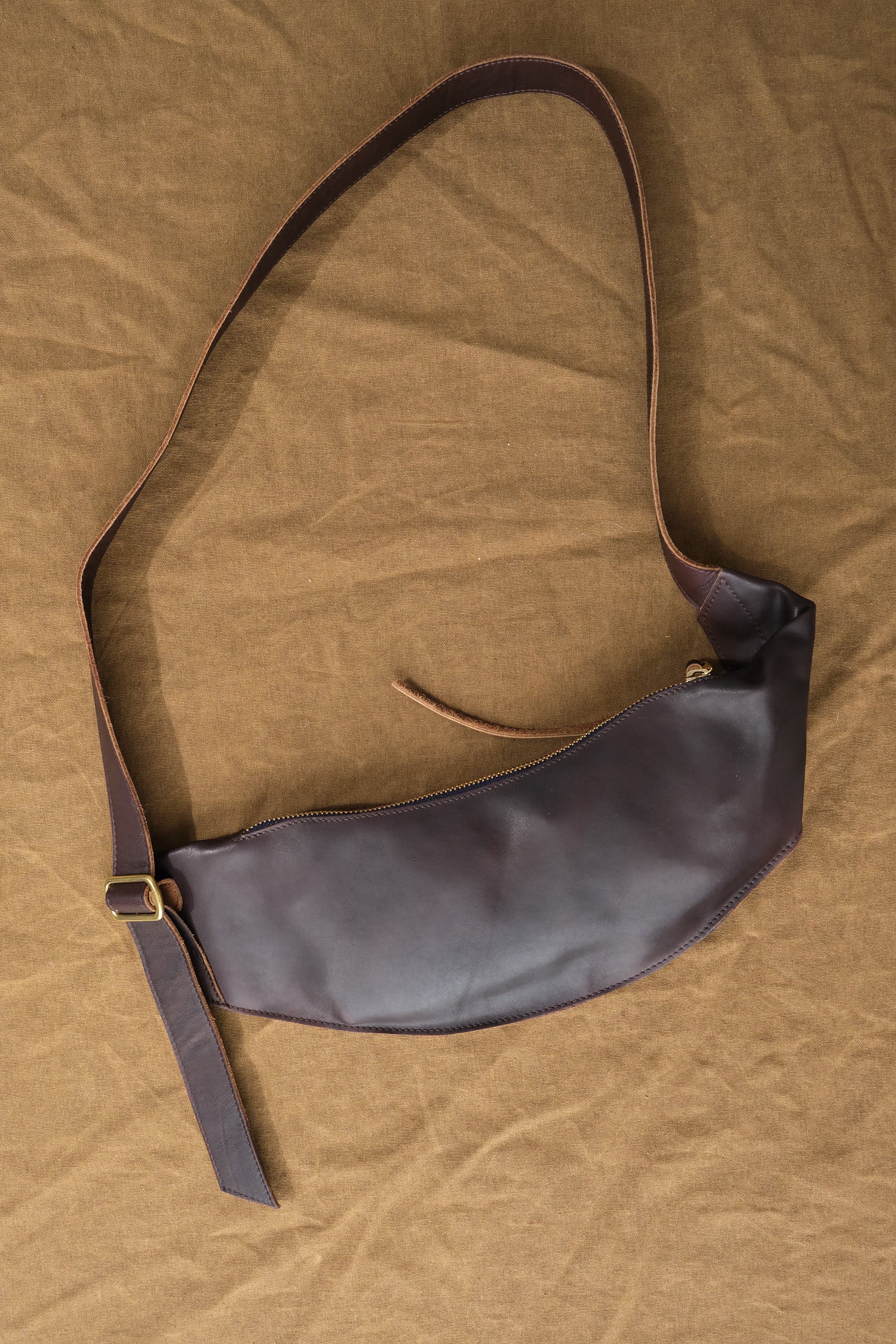 Sling Pouch in Walnut on table