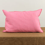 16" X 24" Washed Linen Vise Versa Cushion in Bonbon on table