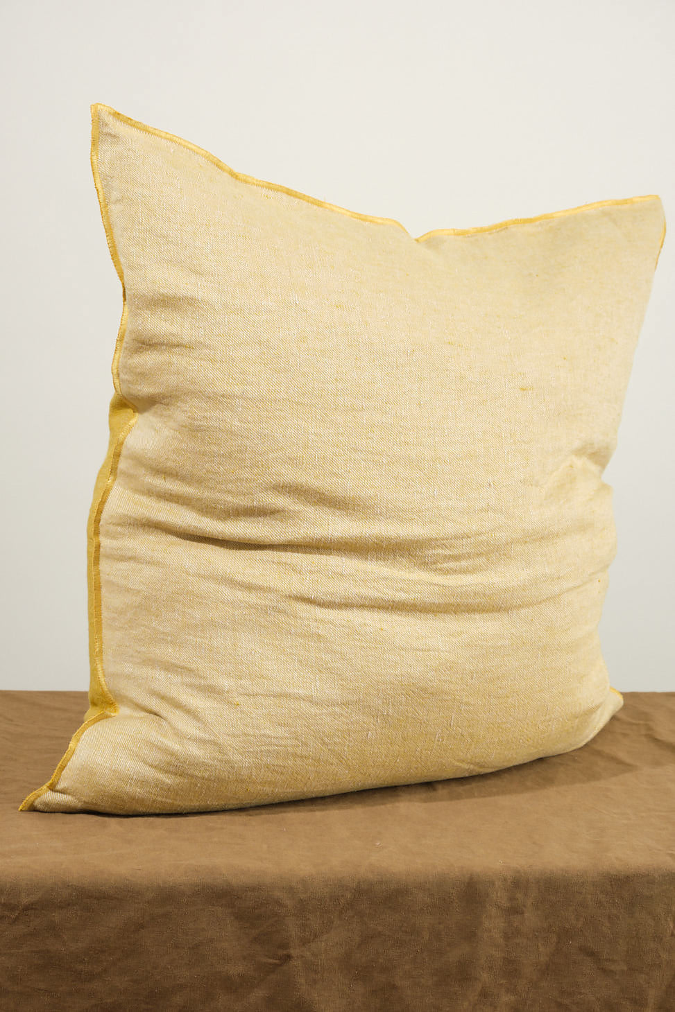 Back of 26" X 26" Crumpled Washed Linen Vice Versa Cushion in Ocre