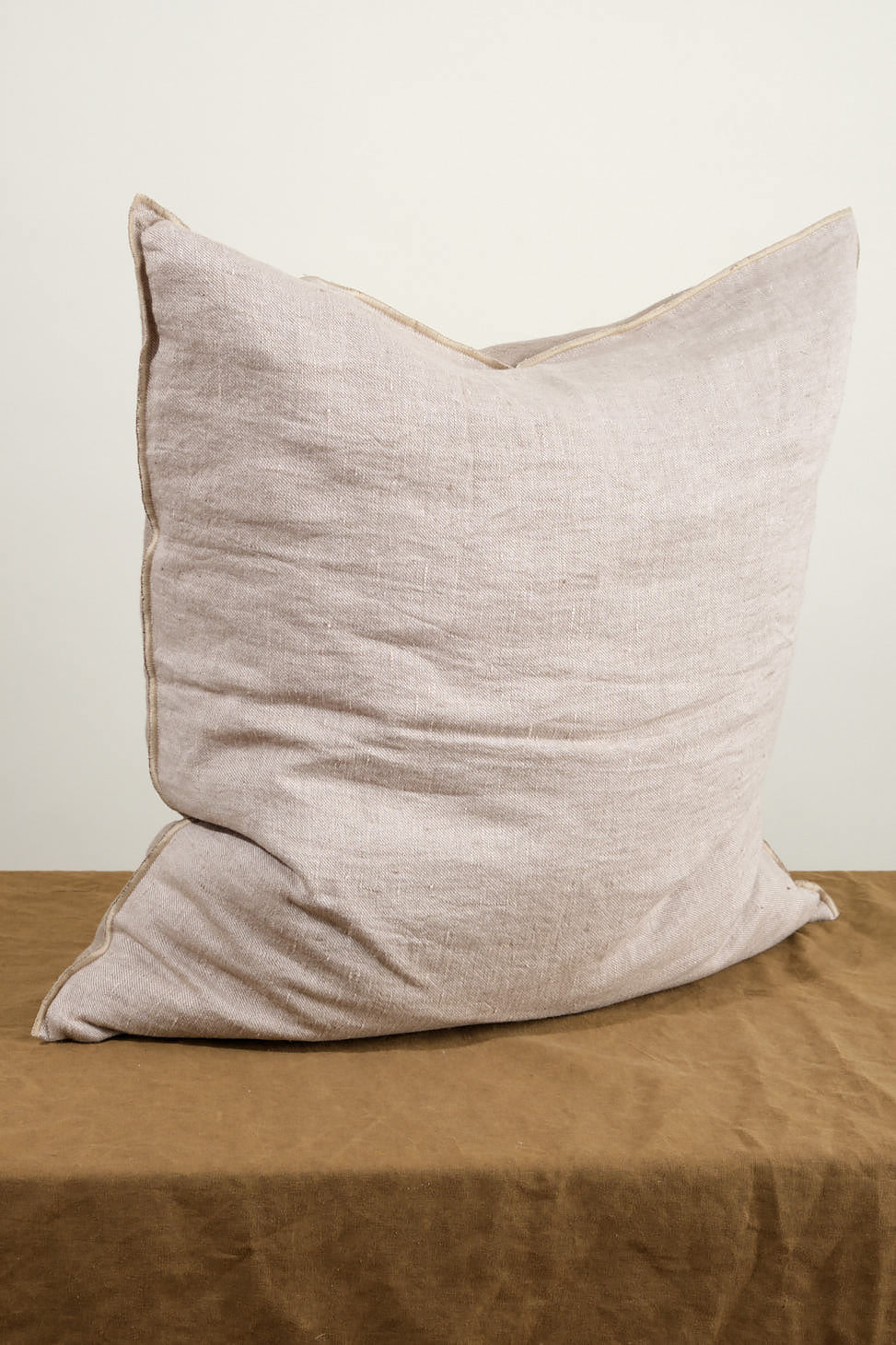 Side of 26" X 26" Crumpled Washed Linen Vice Versa Cushion in Taupe