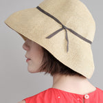 Side of Low Wide Paper Hat in Natural/Charcoal