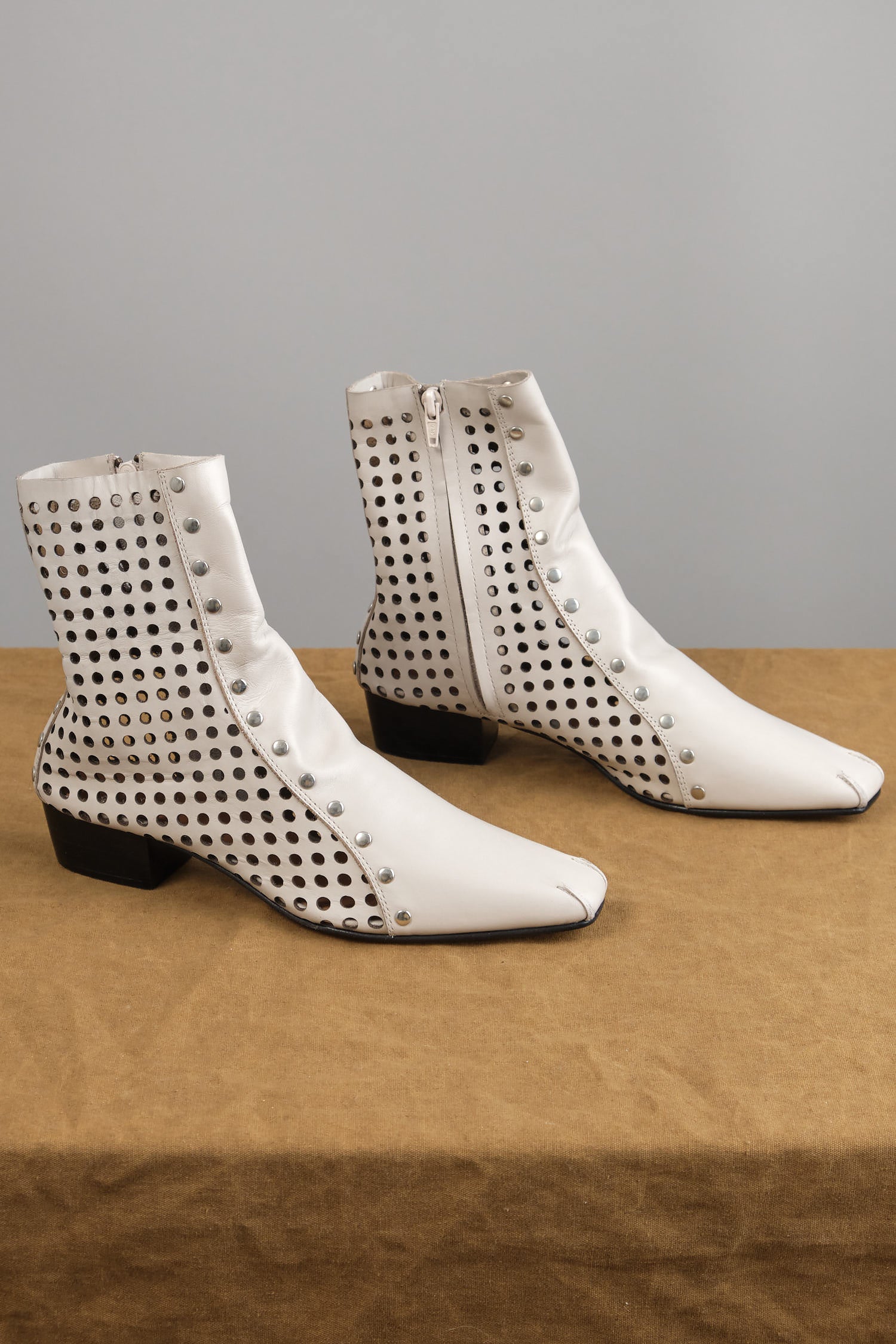 Studded Cove Boot in Bone on table