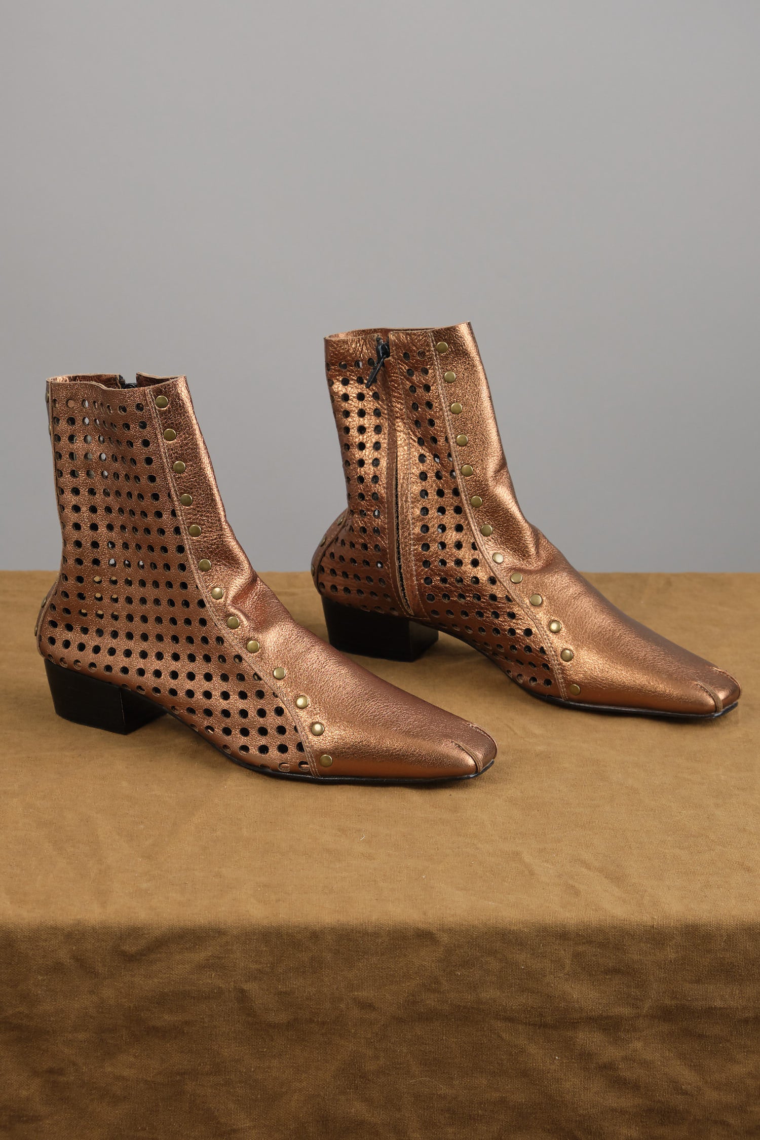 Studded Cove Boot in Bronze on table