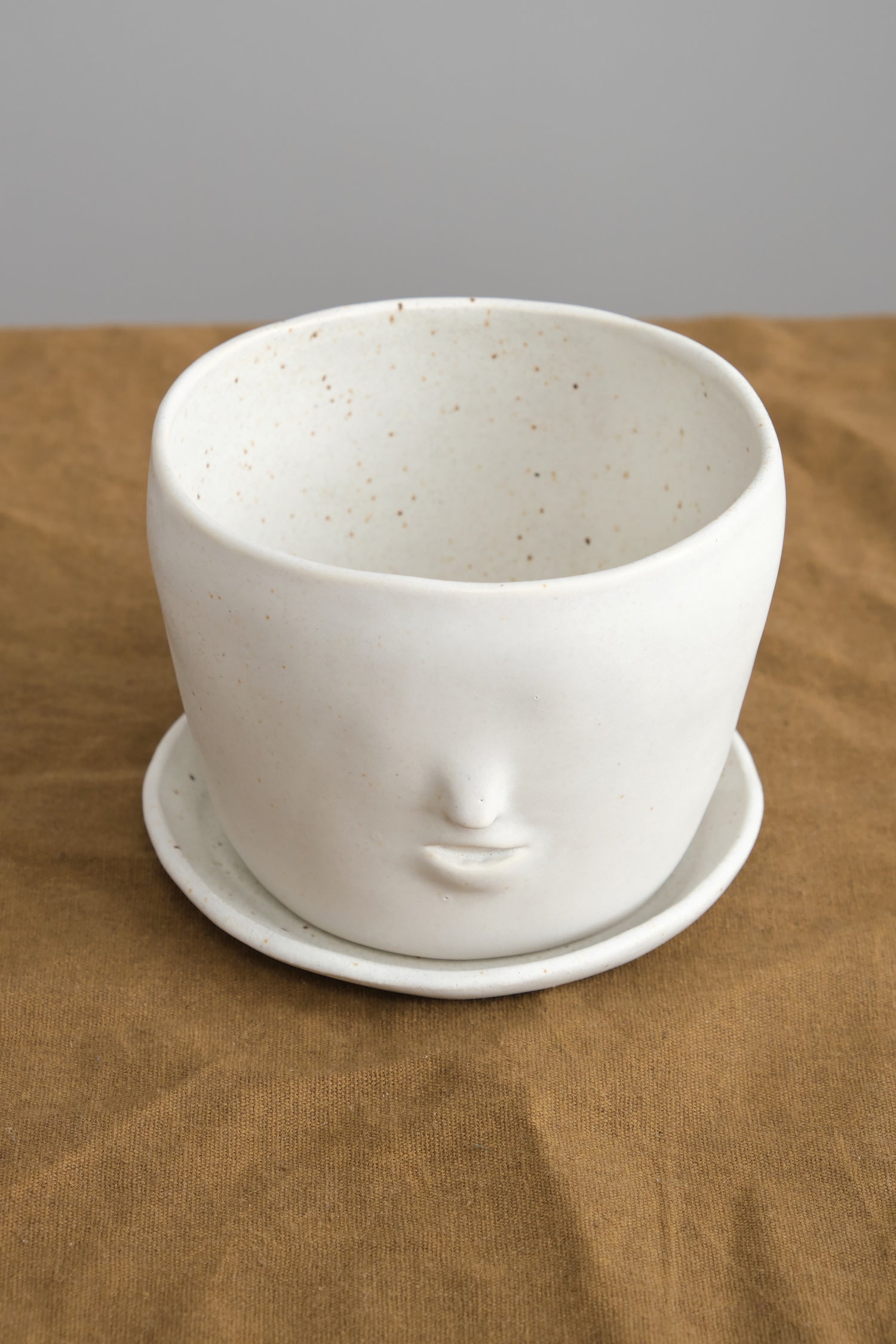Face Pot Set in Oatmeal on table