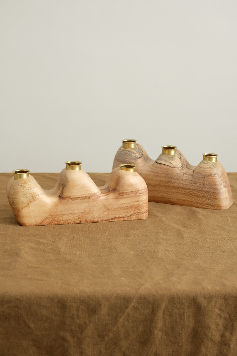 Triple Flow Candle Holder in Maple on table