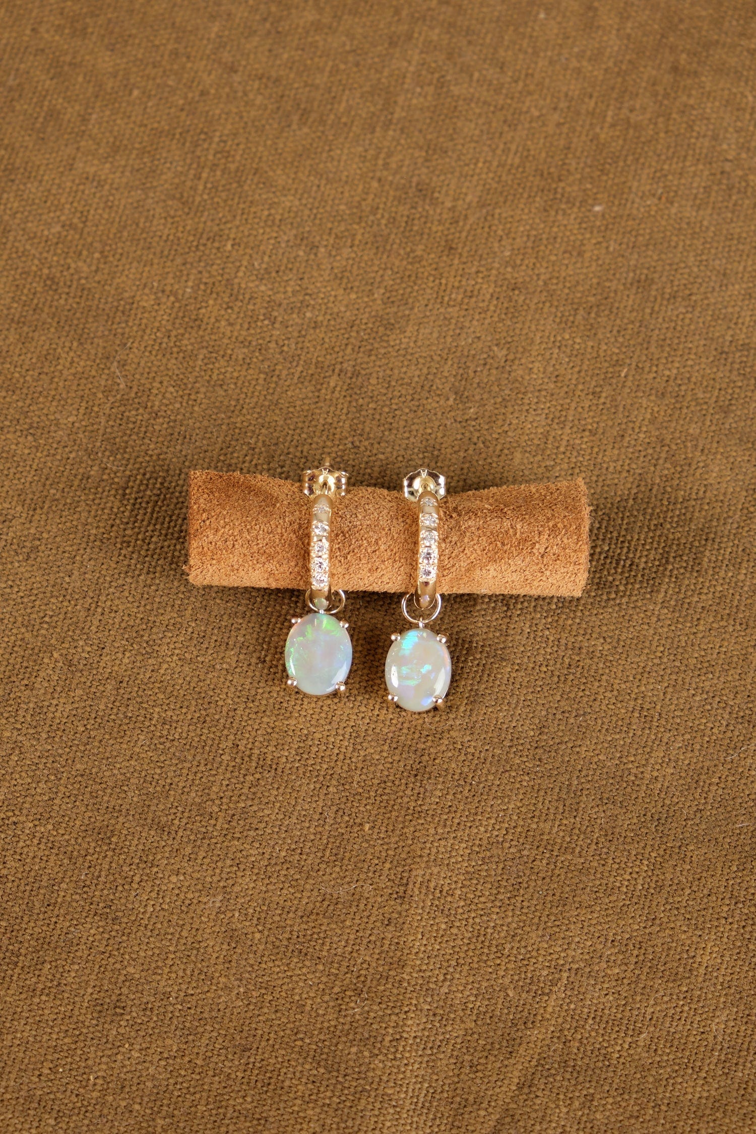 Graduated Diamond Hoops with Opal on display